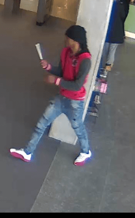 unk subject in red hoodie and ripped jeans